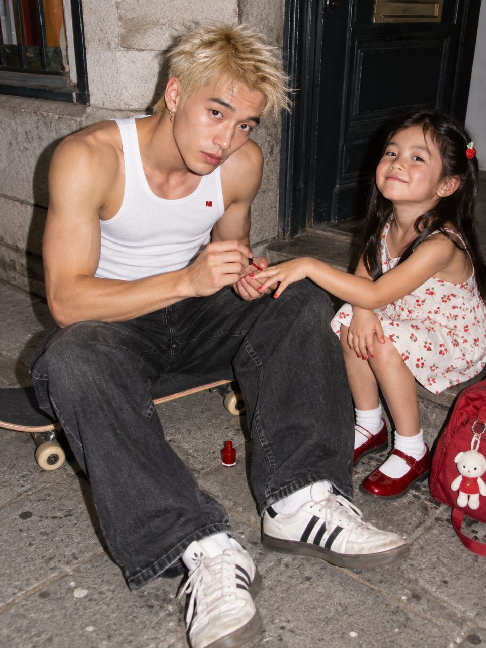 Kenji painting his little sister's nails